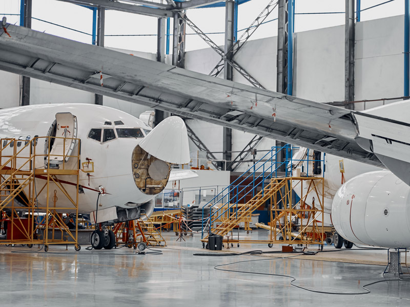 Internal and external components due for repair on aeroplanes in hanger to represent industry specific bill of materials for aerospace manufacturing