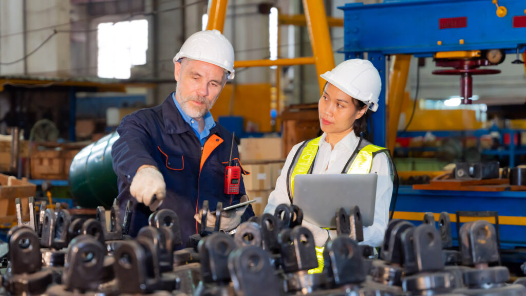 Mar Bal Inc. Featured Image showing coworkers discussing production of metal and plastic components for insulators