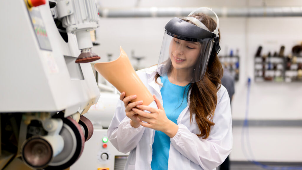 Medical Devices featured image shows woman manufacturing prosthetic limb in medical factory