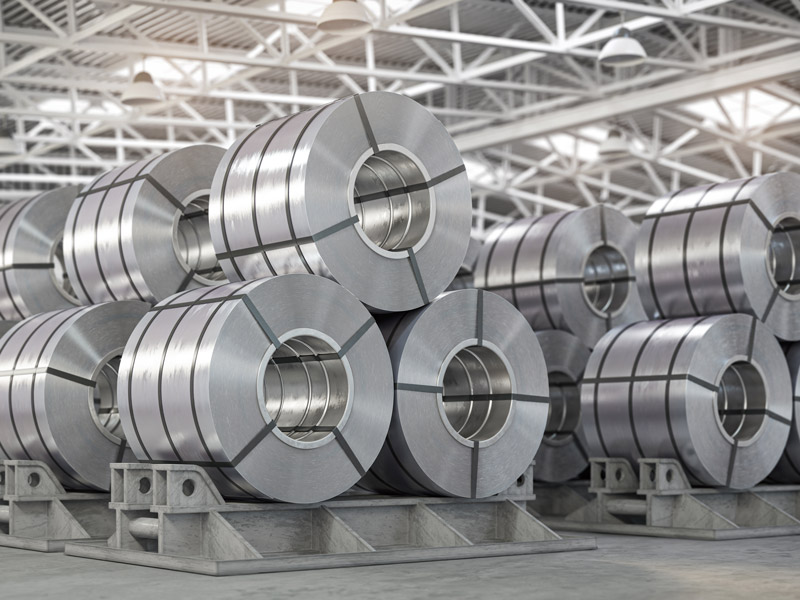 Real-time stock control showing metal sheets stacked up in factory warehouse