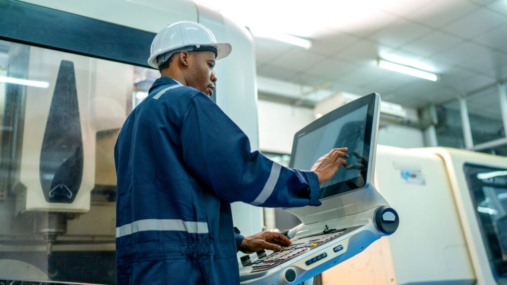 Nordell Case Study featured image showing male worker operating plastic factory machinery