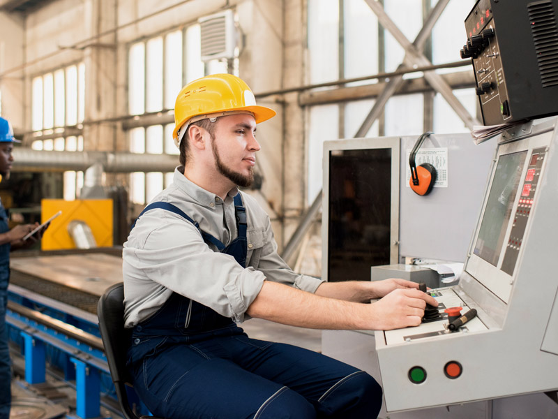 Factory shop floor worker receives work orders directly to computer to begin manufacturing