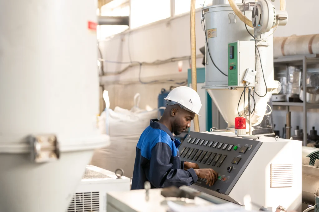 Factory worker operating DELMIAWorks