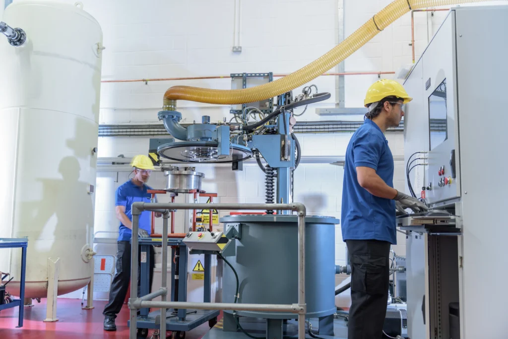 Manufacturing plant workers operating an ERP system